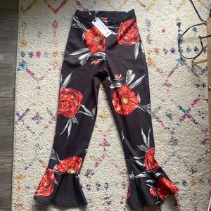 Boohoo cropped pants Black with Red flowers and ruffle hem. Size 4